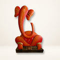 Attractive Orange Ganesha Playing Tabla